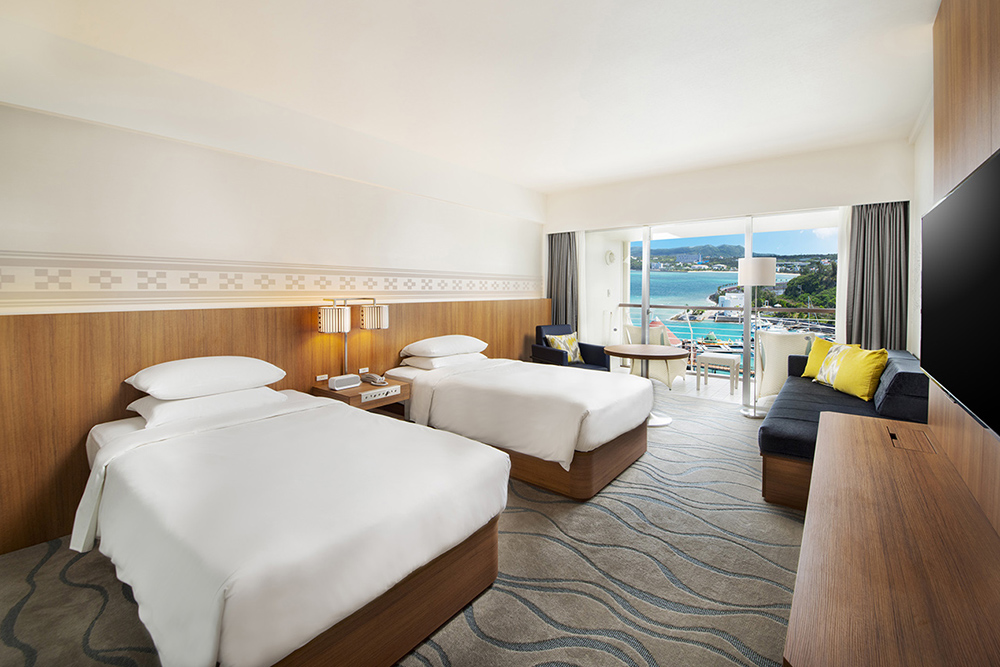 twin guest room with a view of the ocean